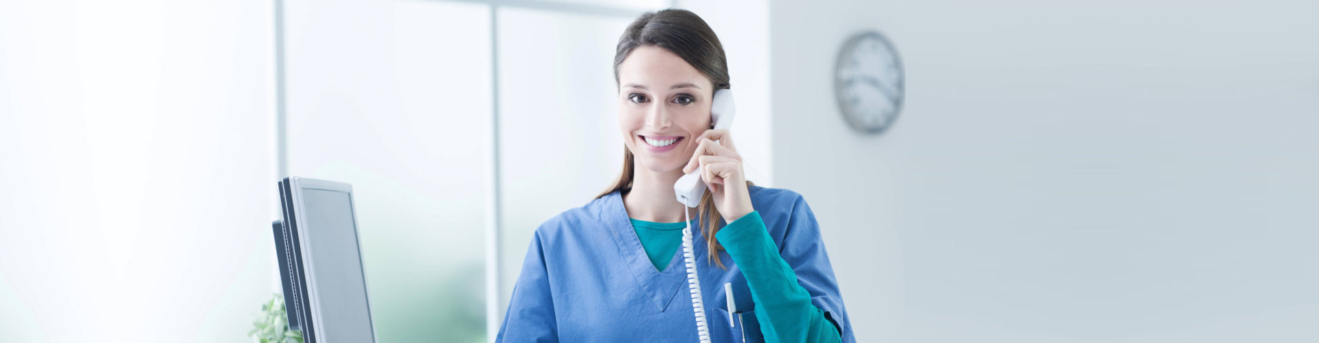 smiling nurse taking call